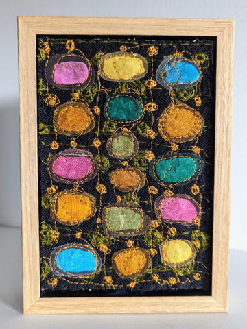 Patricia Kelly, Coloured Dots on Black Background, textile art, 10.5 x 15.5 cm (12.5 x 17.5 x 3 cm framed)